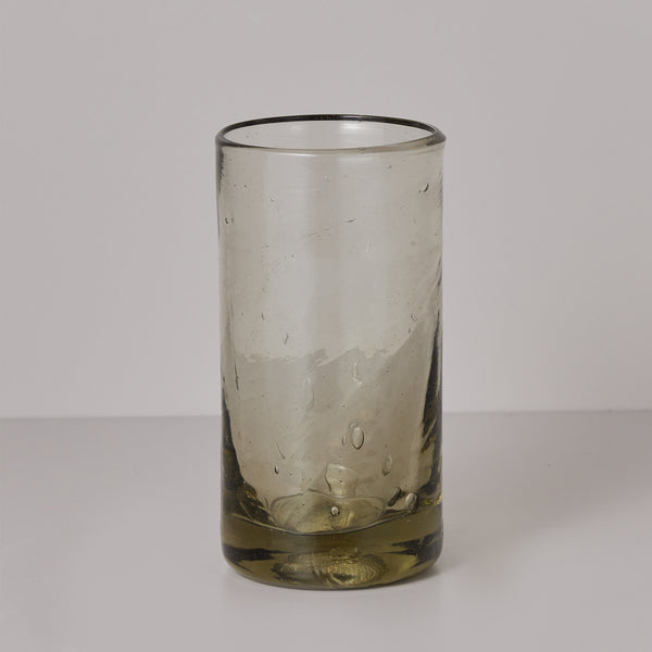 Hand blown olive colored drinking glass. 