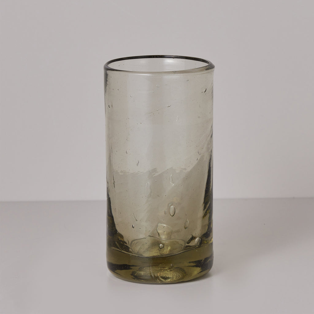 Hand blown olive colored drinking glass. 